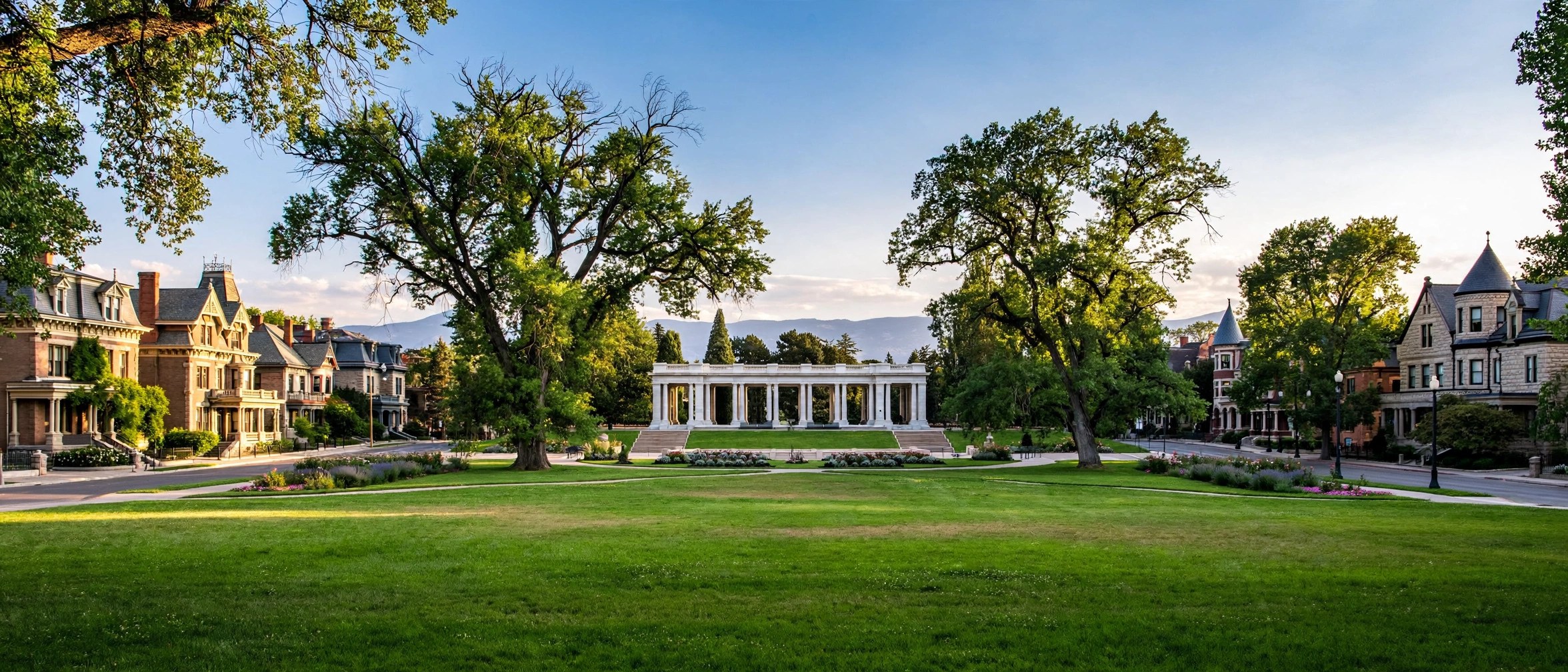 Elegant historic apartment buildings and mansions facing a manicured urban park